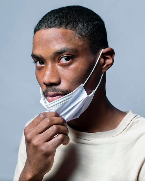 Portrait young man wearing mask