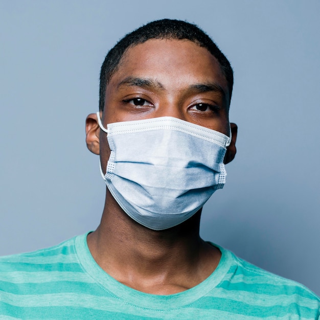 Portrait young man wearing mask