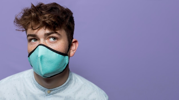 Portrait young man wearing mask