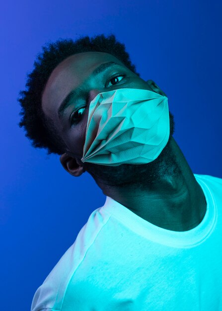 Portrait young man wearing mask