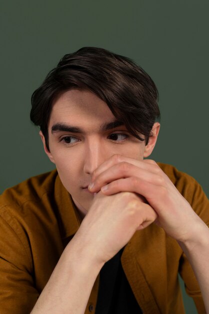 Portrait young man wearing shirt posing