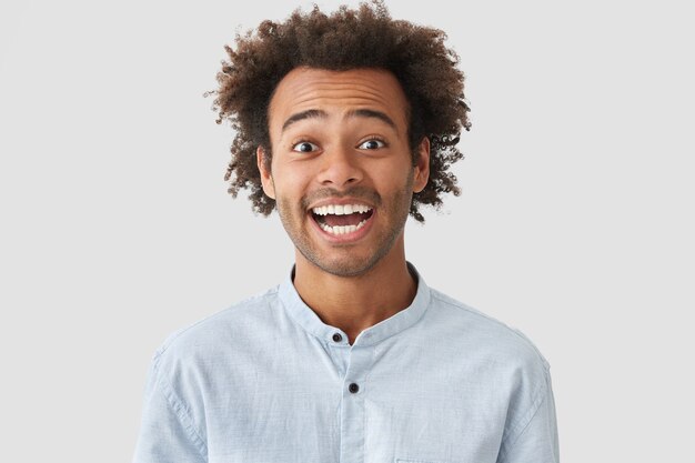 Portrait of young man with curly hair wearing shirt