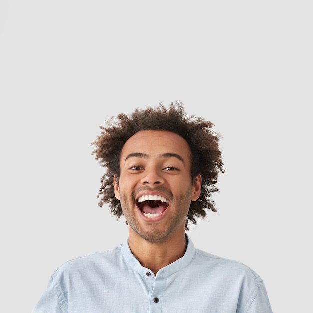 Portrait of young man with curly hair wearing shirt