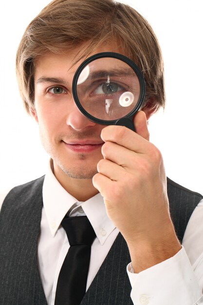 portrait of young man with magnifying