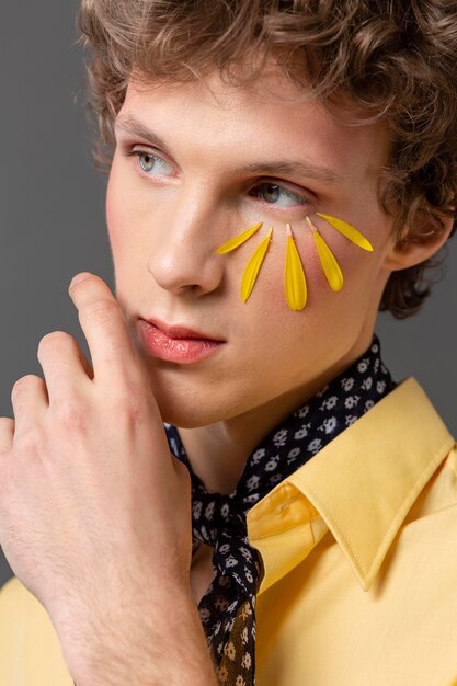 Portrait young man with make up posing