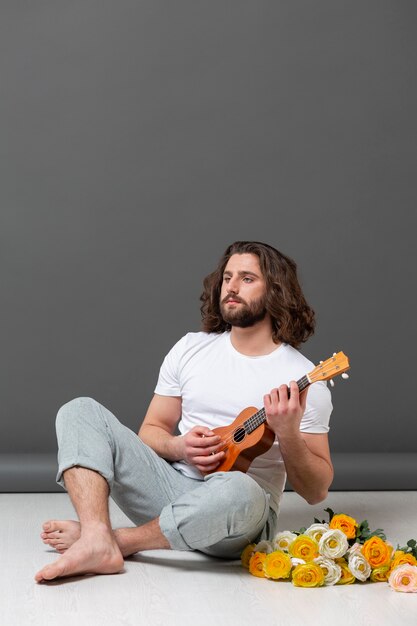 Portrait young man with ukulele