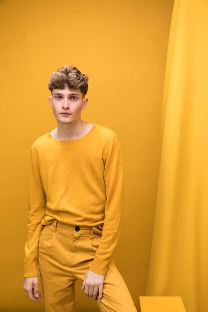 Portrait of a young man in a yellow scene