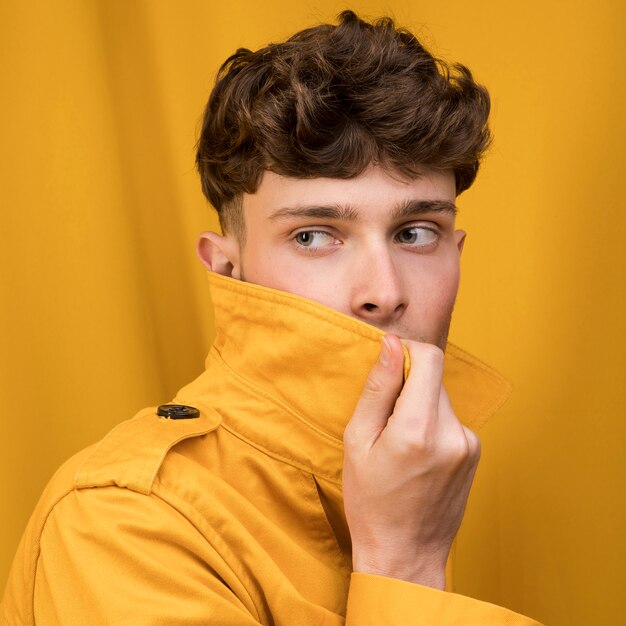 Portrait of a young man in a yellow scene