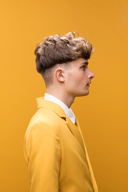 Free photo portrait of a young man in a yellow scene