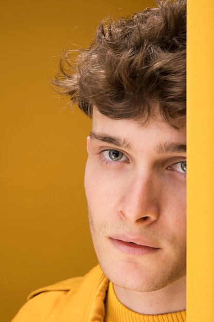 Portrait of a young man in a yellow scene