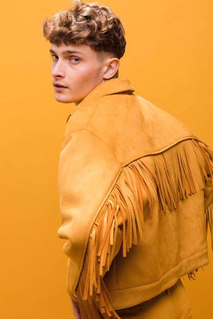 Portrait of young man in a yellow scene