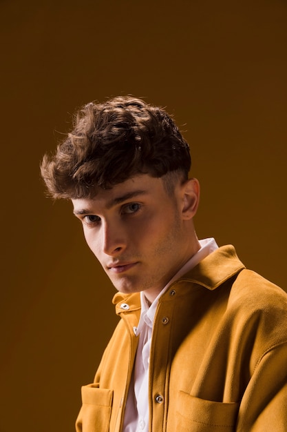 Portrait of young man in a yellow scene