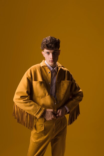 Portrait of young man in a yellow scene