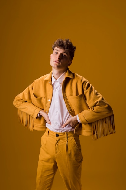 Portrait of young man in a yellow scene