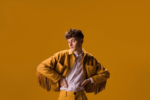 Portrait of young man in a yellow scene