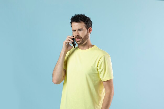 Portrait of young man in a yellow shirt