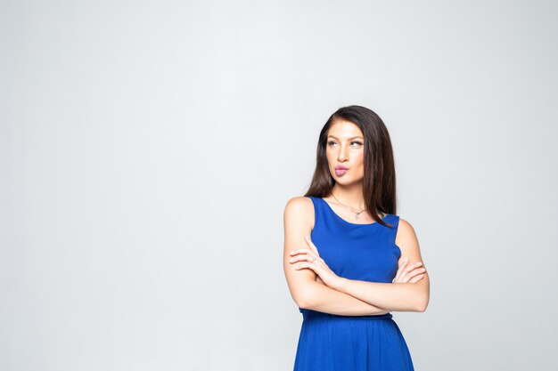 Portrait of young n woman standing with folded hands