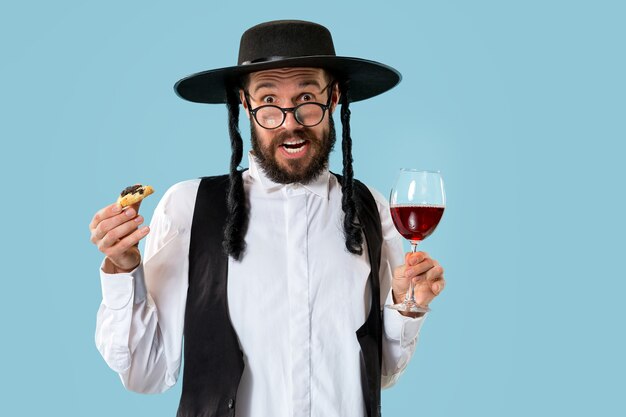 Portrait of a young orthodox jewish man during festival purim.