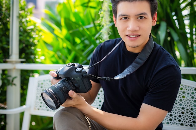 Portrait of young photographer man