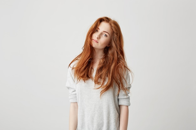 Portrait of young pretty girl with beautiful foxy hair .