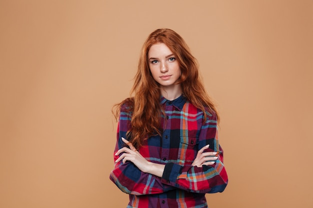 Portrait of a young pretty redhead girl