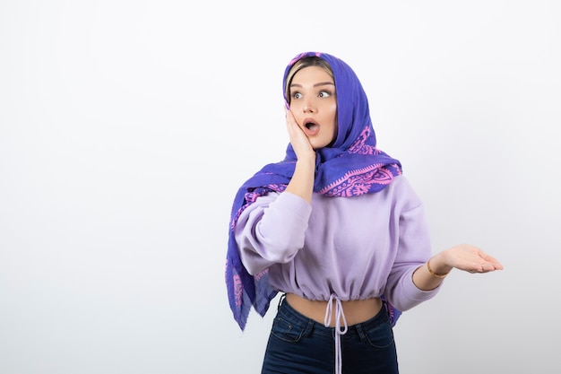 Portrait of a young pretty woman model standing and posing.