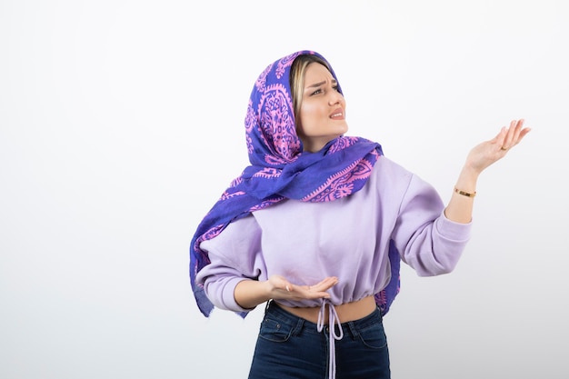 Portrait of a young pretty woman model standing and posing .