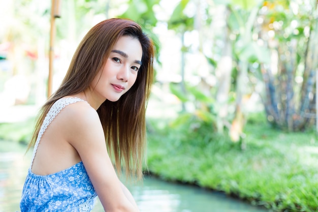 Portrait young pretty woman in park