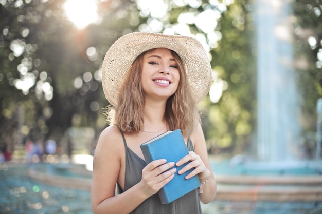 portrait of a young pretty woman with a  book