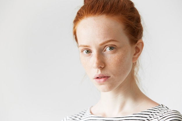 Portrait of young red-haired woman