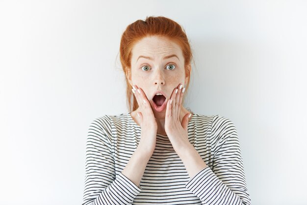 Portrait of young red-haired woman