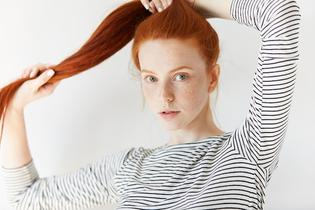 Portrait of young red-haired woman