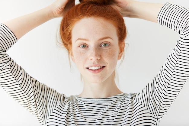 Free photo portrait of young red-haired woman