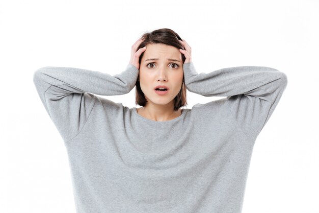 Portrait of a young shocked woman