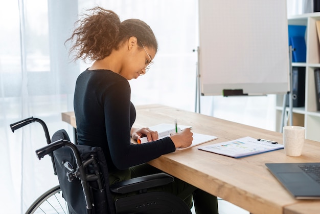 Portrait of young signing papers at the office