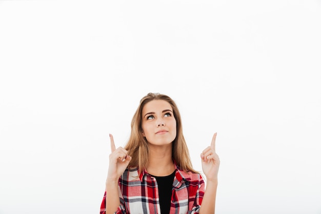 Free photo portrait of a young smiling girl in plaid shirt