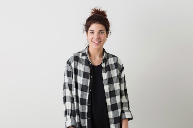 Portrait of young smiling happy hipster pretty woman in checkered shirt posing isolated
