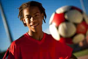 Free photo portrait of young soccer player