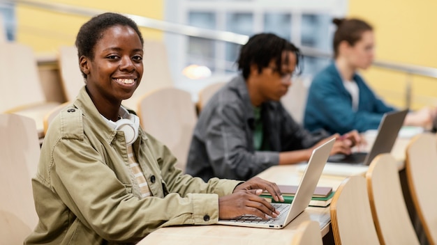 Free photo portrait of young student in class