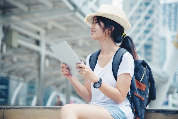 Portrait of young student girl smiling working and learning on laptop computer 