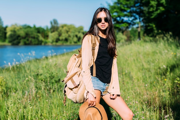 Portrait of young stylish female hiker