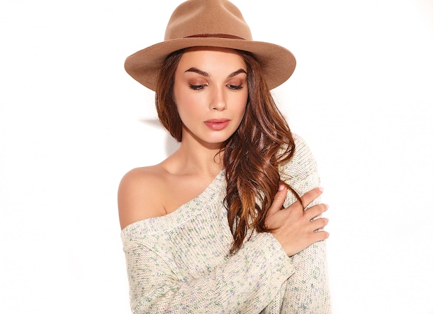 Portrait of young stylish girl model in casual summer clothes in brown hat with natural makeup isolated.