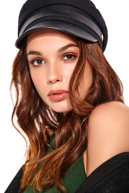 Portrait of young stylish laughing model in black casual summer clothes in cap with natural makeup on white