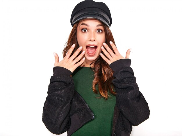 Portrait of young stylish surprised model in colorful casual summer clothes with natural makeup on white