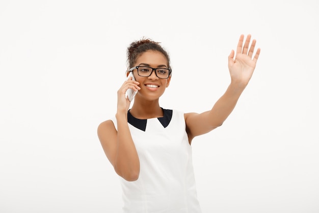 Portrait of young successful african business lady on white