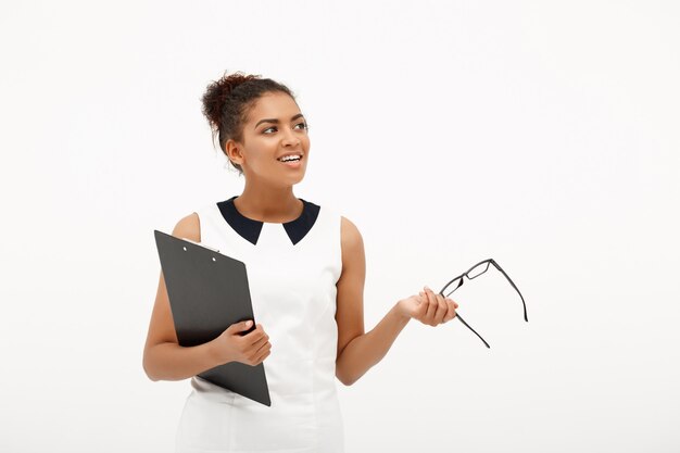 Portrait of young successful african business lady on white