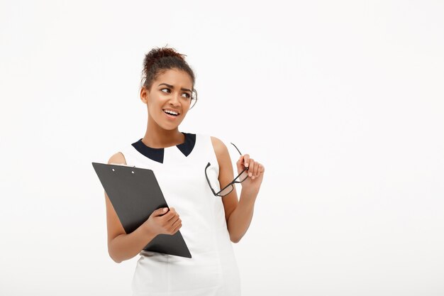 Portrait of young successful african business lady on white