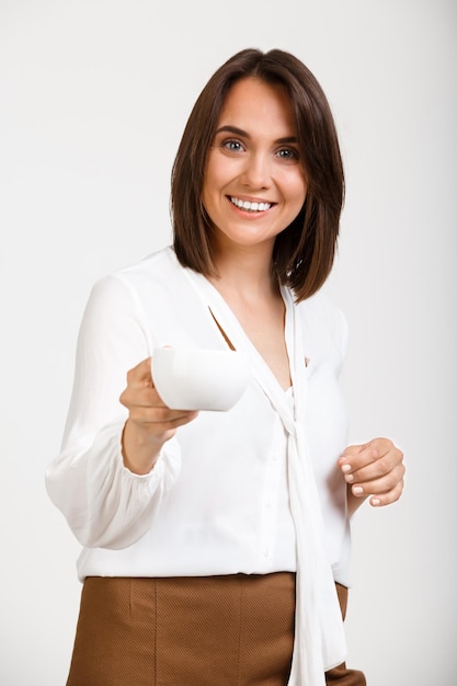 Portrait of young successful business woman over white backgroun