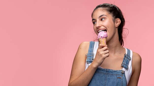 Portrait of young teenage girl eating an ice cream