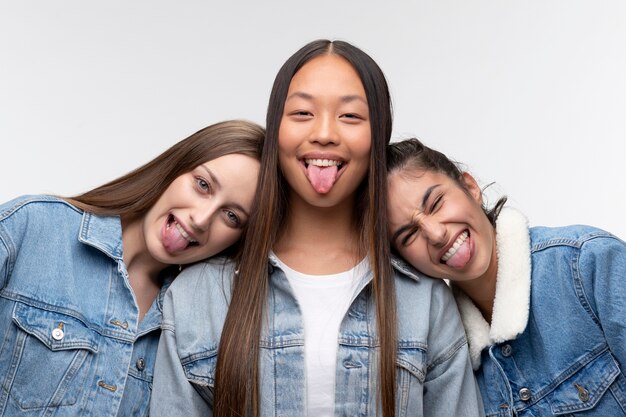 Portrait of young teenage girls posing together